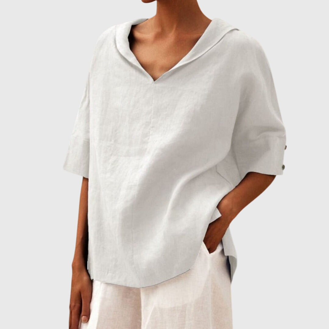 White relaxed fit women's blouse, comfortable long sleeve top. Ideal for casual everyday fashion apparel.