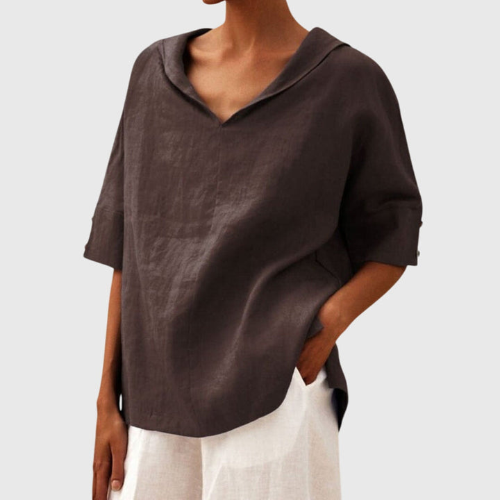 Stylish brown relaxed fit blouse for women. Comfortable long sleeve top, ideal for casual everyday wear.
