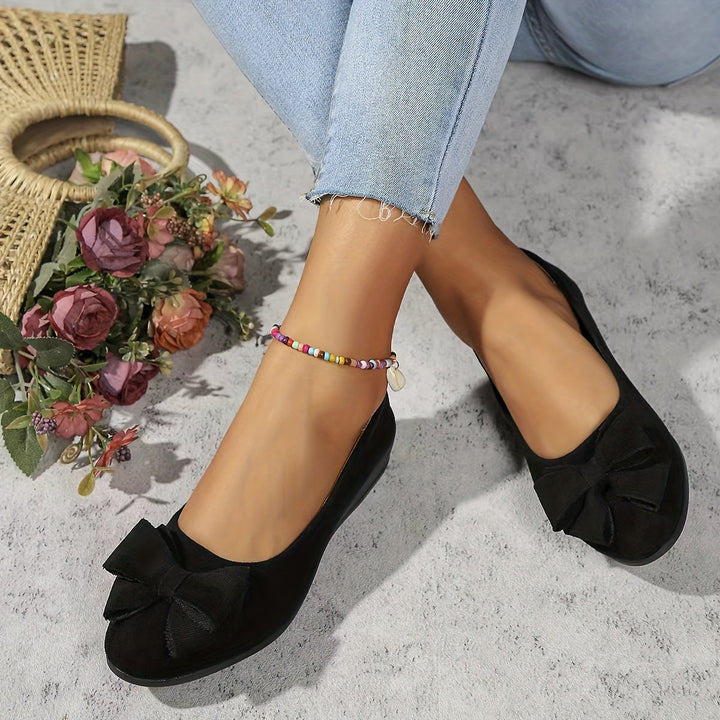 Versatile women's wedge flats, ideal for casual or dressy looks, bow detail.