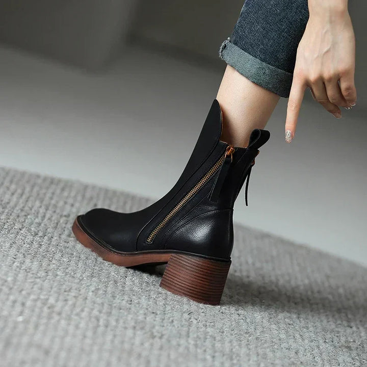 Stylish women's block heel boots with a convenient side zipper, ideal for winter outfits and comfort.