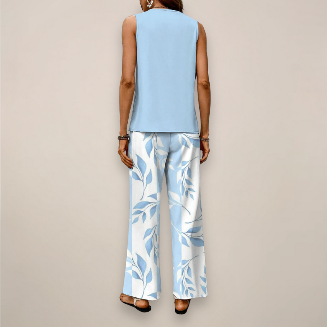 Boho chic women's two-piece outfit featuring a vibrant print and relaxed wide-leg trousers.