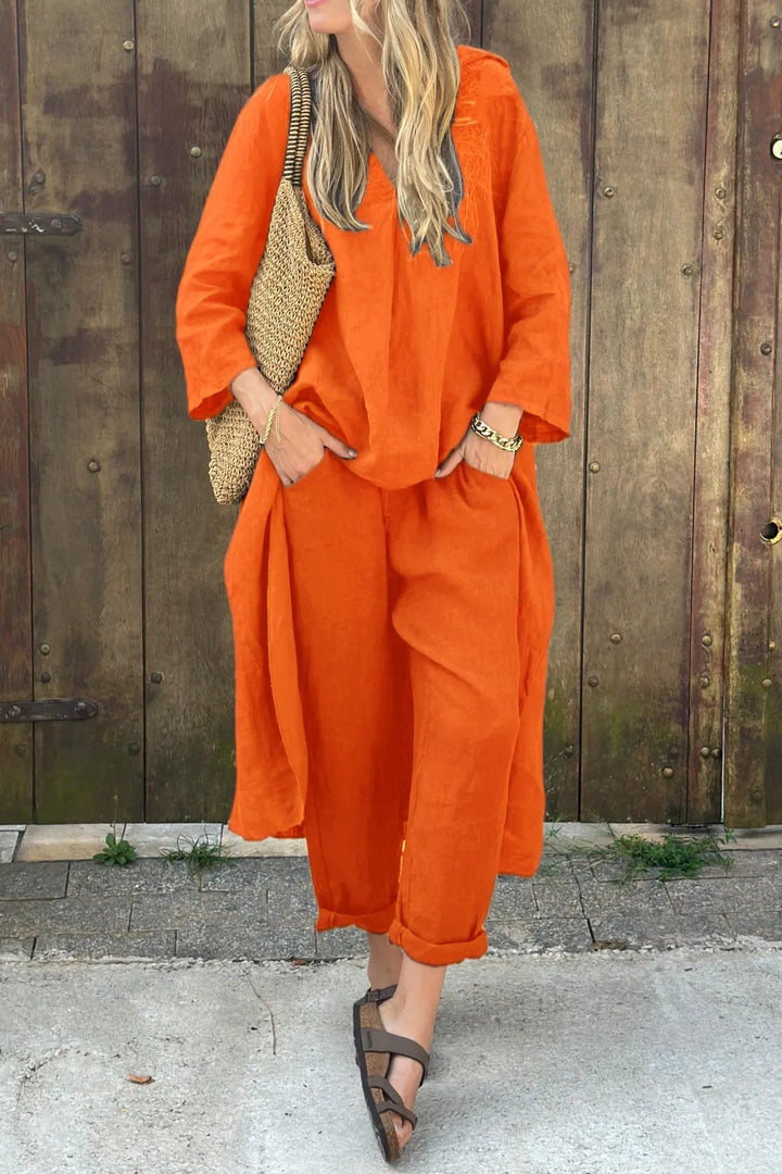 Full body shot of a model in a casual blue women's relaxed tunic and pant set