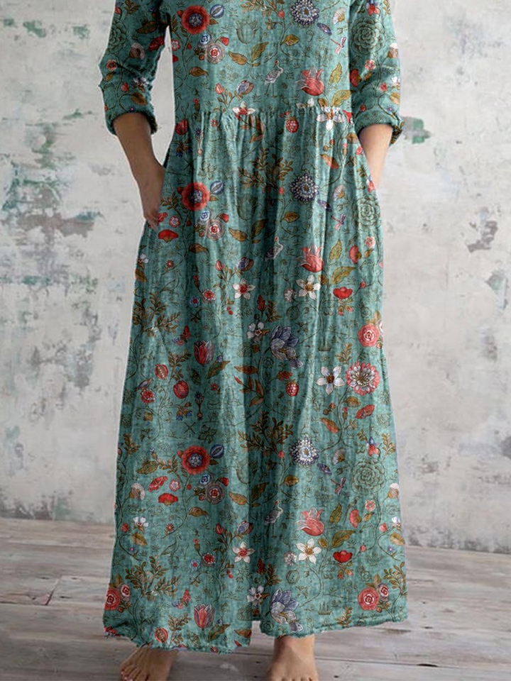 Stylish women's floral boho maxi dress with V-neckline & functional pockets, great for casual spring outfits.