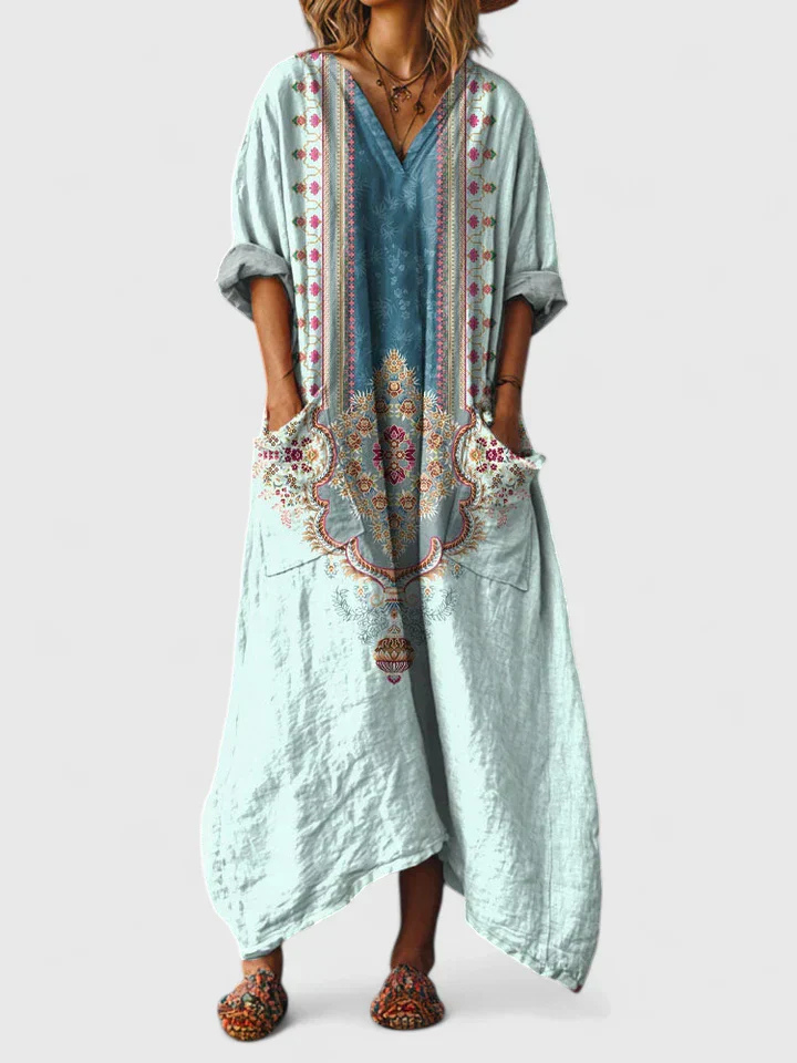 Flowy women's bohemian print maxi dress with a flattering v-neck, 3/4 sleeves & functional pockets.