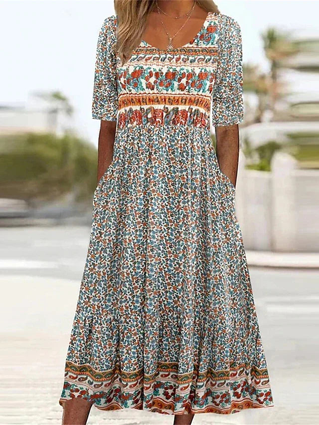 Women's boho print midi dress with short sleeves, round neck & pockets. Effortless summer style.
