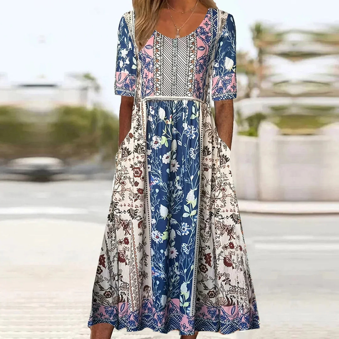 Stylish women's summer midi dress featuring a vibrant boho print, short sleeves & convenient pockets.