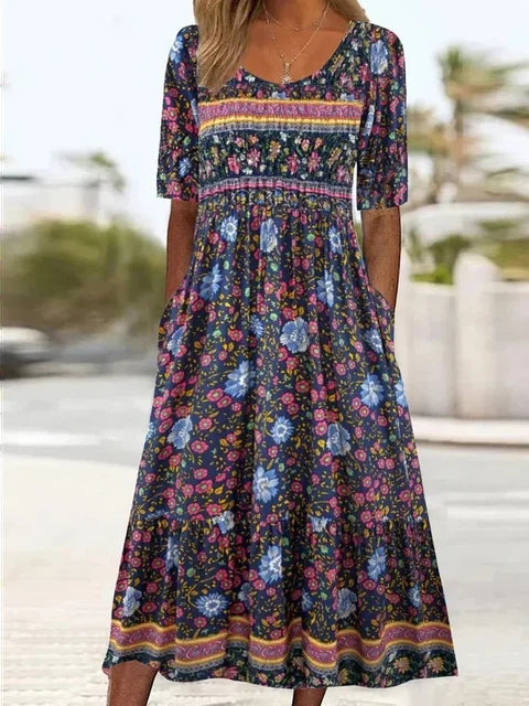 Women's short sleeve midi dress with an eye-catching boho print. Perfect casual summer dress with pockets.