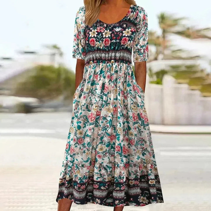 Boho print midi dress for women. Round neck, short sleeves, and handy pockets. Ideal for effortless style.
