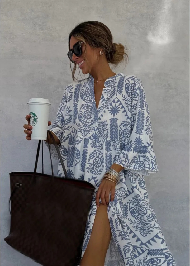 Elegant women's flowy midi dress featuring a vibrant boho print, oversized fit, and long sleeves for a chic summer look.