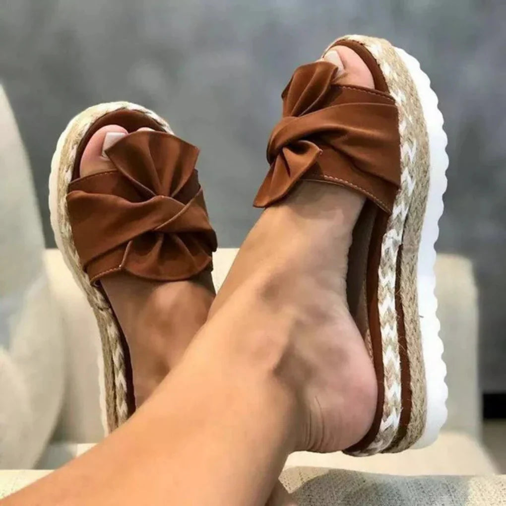 Trendy women's bow platform slide sandals, a must-have for warm weather casual footwear