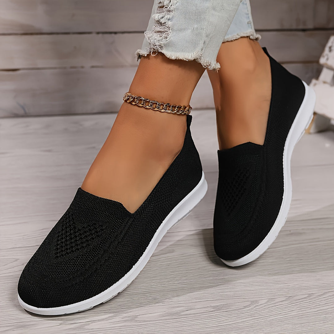 Women's walking shoes designed for all-day comfort, featuring a breathable and easy slip-on style.