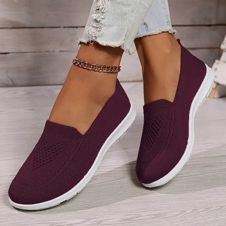 Lightweight women's travel shoes, slip-on and breathable for comfortable all-day walking adventures.
