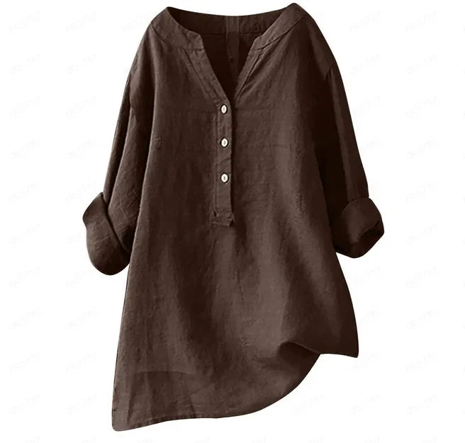 Woman wearing a breezy button-up summer shirt, flowy and relaxed for a comfortable vacation look.