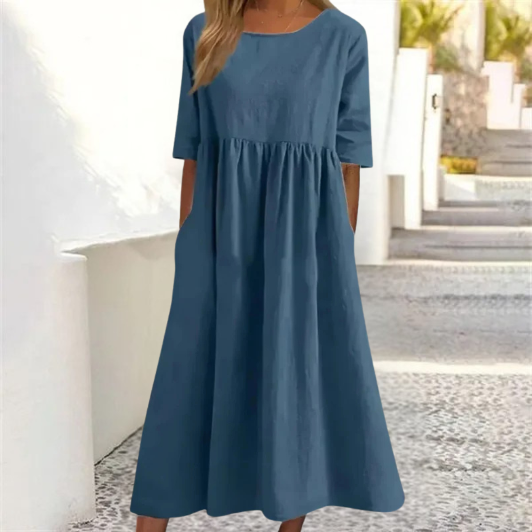 Casual A-line summer midi dress for women, featuring a smocked waist, short sleeves, and pockets.
