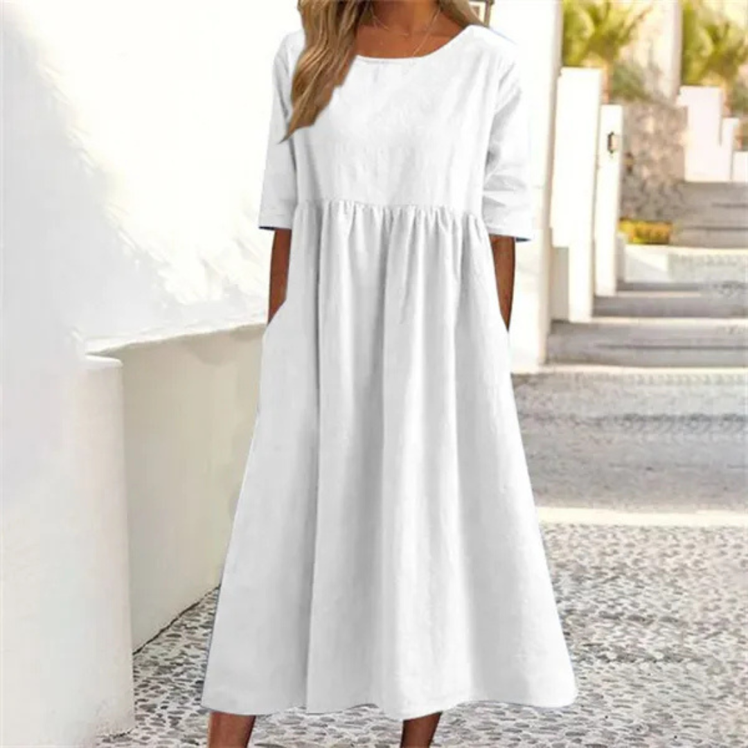 Breezy women's short-sleeve midi dress, smocked waist, A-line cut, perfect casual summer style.