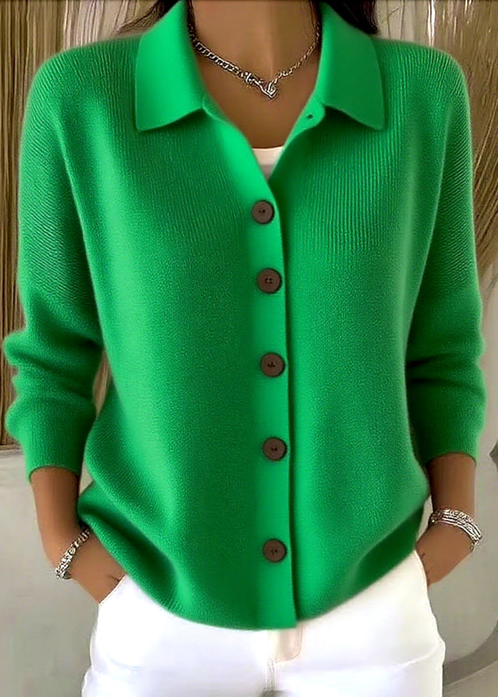 Women's cardigan sweater with button front and shirt-style collar, an elegant top for versatile wear.