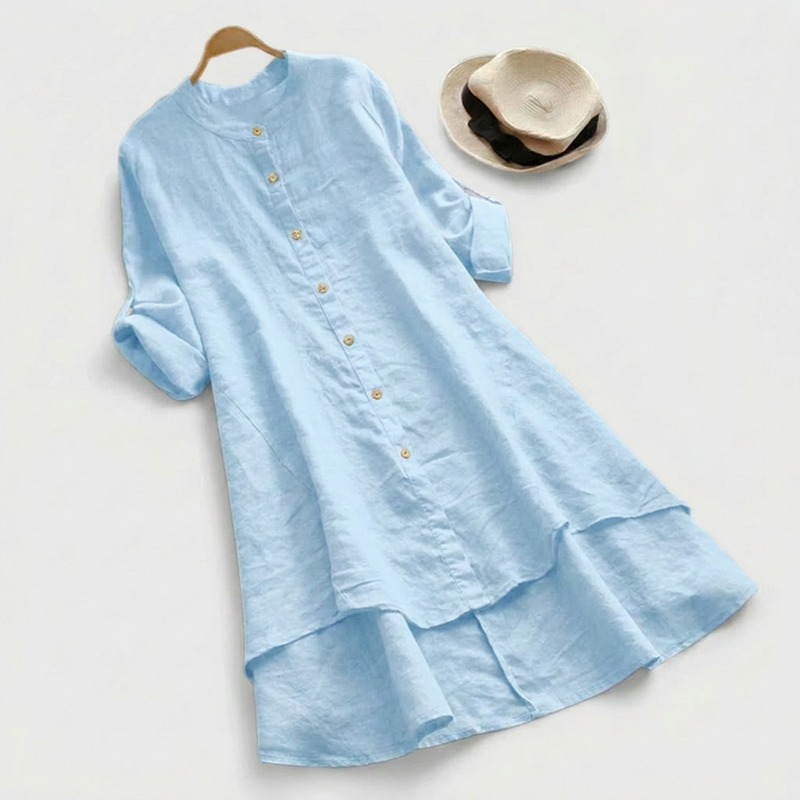 Stylish women's long sleeve button-down shirt dress with a unique layered hem. Comfortable, versatile midi for women.