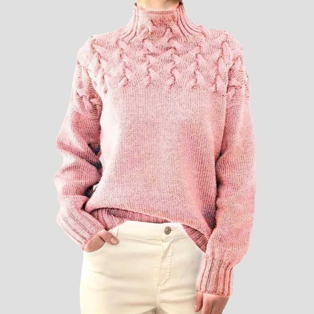 Fashionable women's long sleeve cable knit pullover in blush pink, ideal for spring layering.