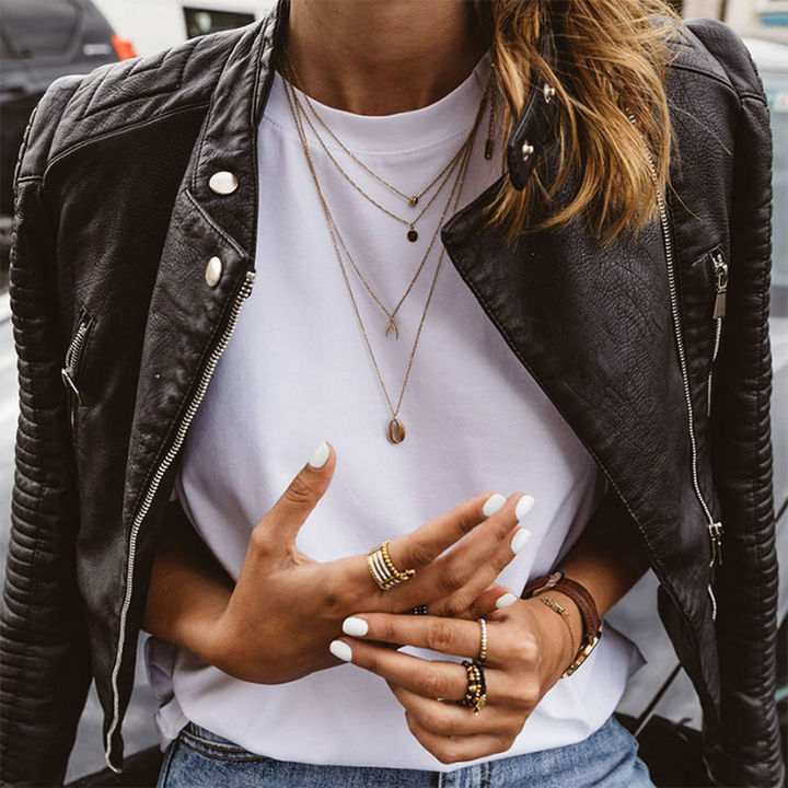 Stylish women's moto jacket in black, featuring a prominent zipper and biker aesthetic