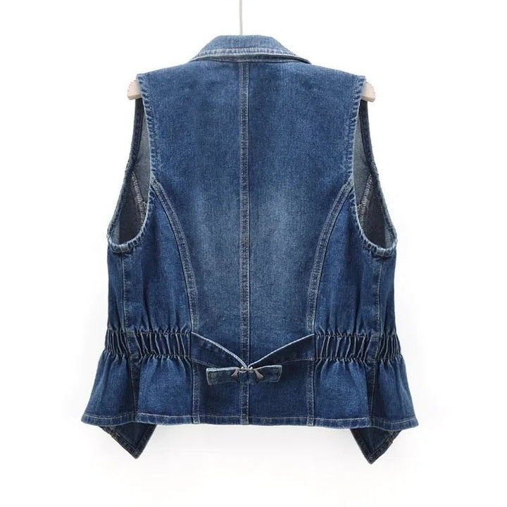 Fashionable women's sleeveless open-front denim vest, a versatile layering piece for casual wear.