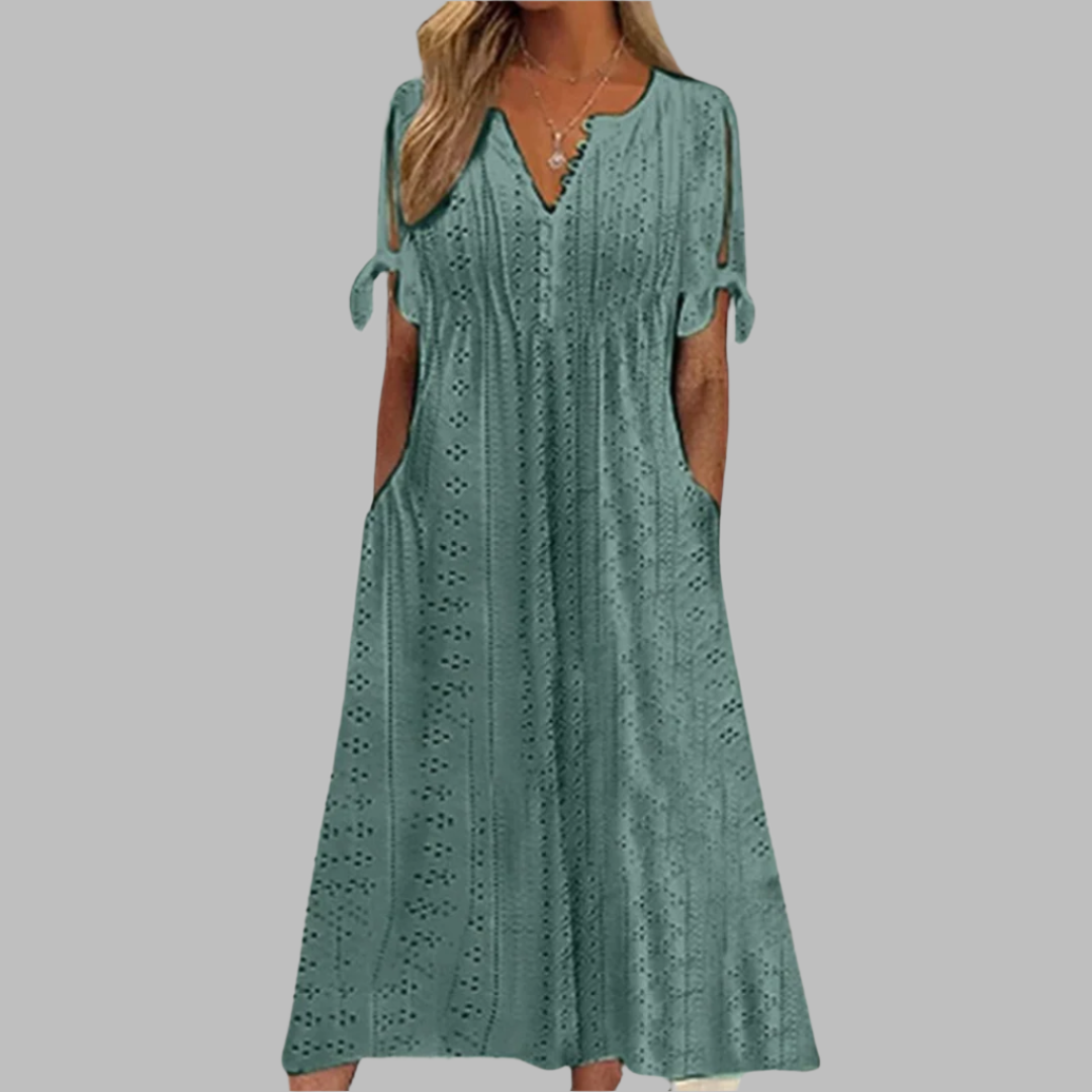 Elegant women's white eyelet boho summer midi dress with V-neck, A-line skirt, and delicate tie-sleeve details.