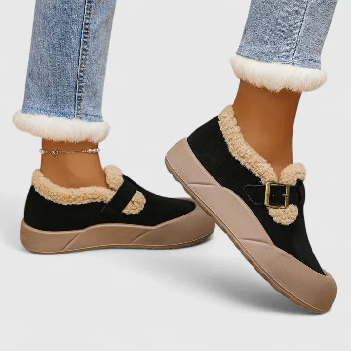 Tan women's slip-on flats with decorative buckle, ideal for summer footwear and casual outings.