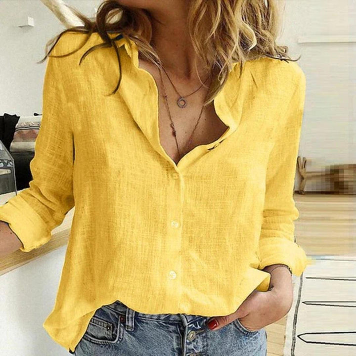 Women's casual button-down blouse with charming bird print. Long sleeve, relaxed fit, perfect for everyday fashion.