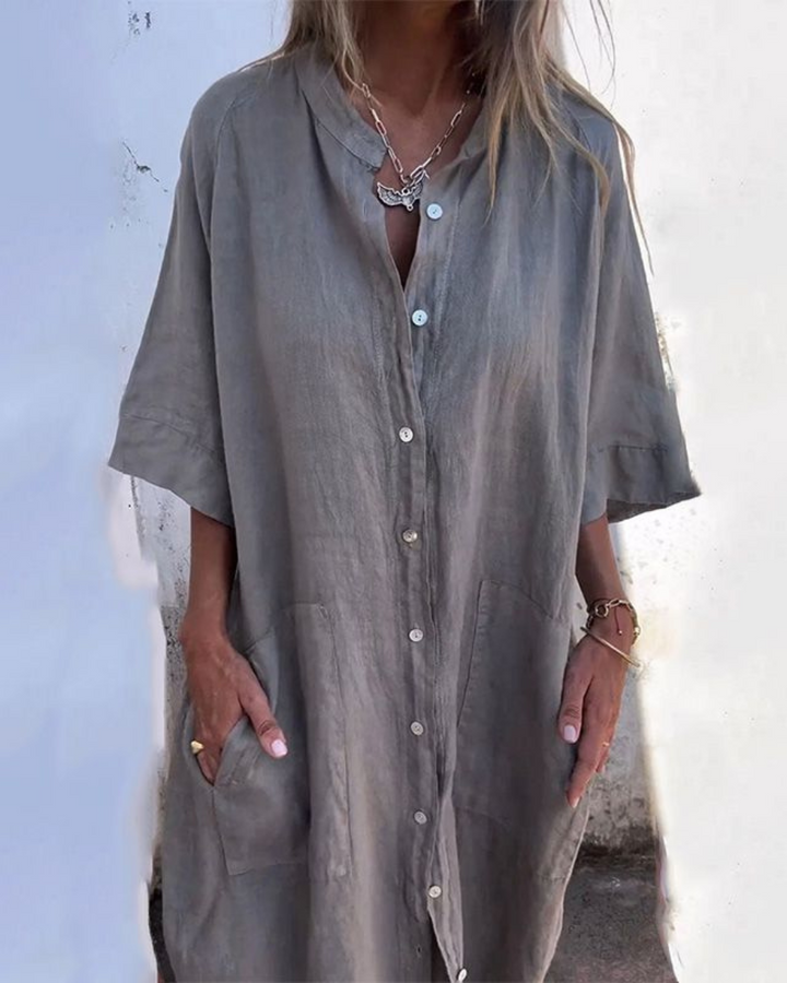 Women's casual button-front shirt dress with short sleeves and practical pockets, perfect for effortless summer style.
