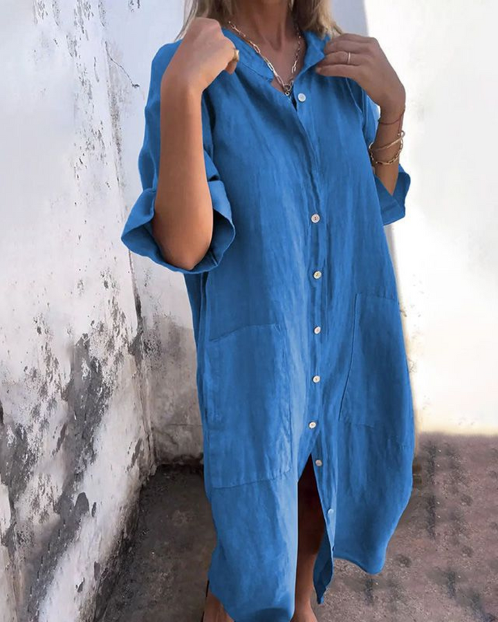 Effortless women's summer shirt dress. Features a button front, short sleeves, and convenient side pockets.