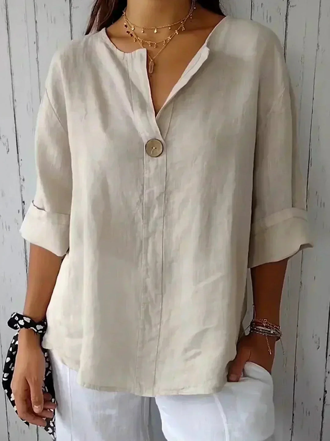 Women's casual button-front tunic blouse with V-neck & 3/4 sleeves. Loose fit, ideal for summer style.