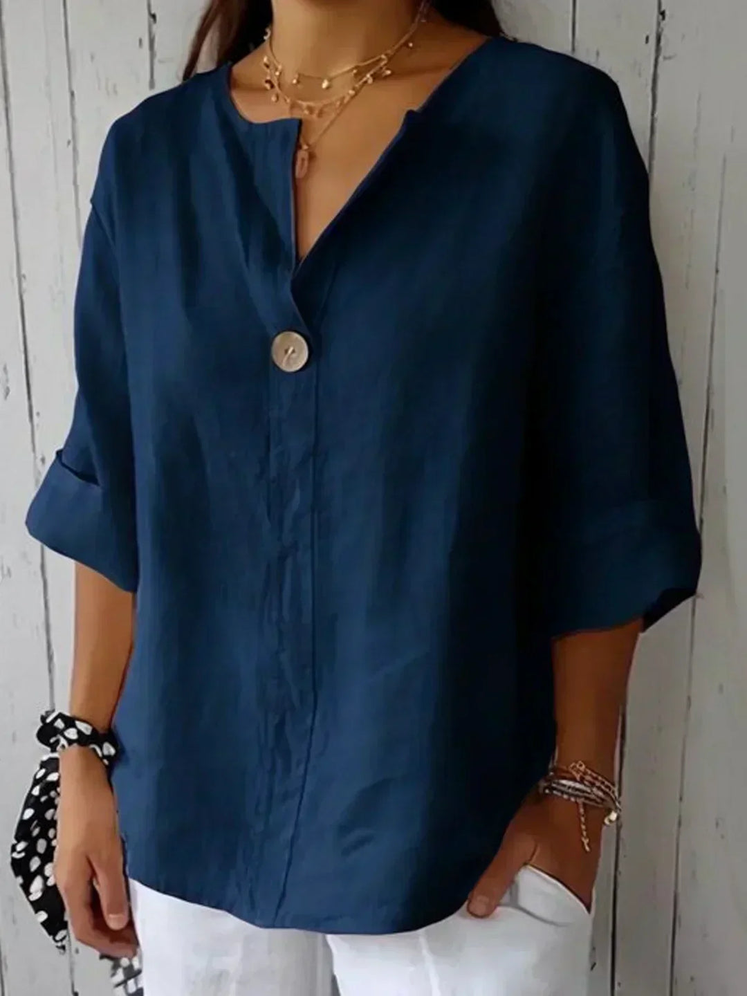 Chic women's V-neck tunic blouse, 3/4 sleeve. Versatile for resort wear, summer, or everyday fashion.