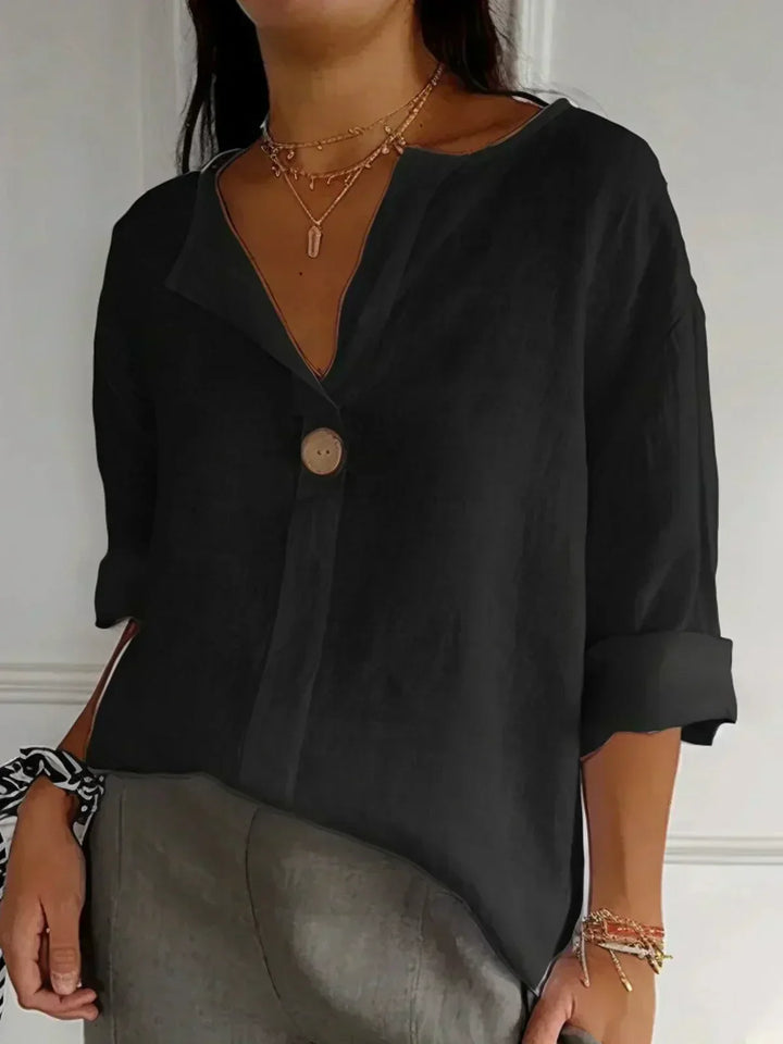 Casual women's button-front tunic blouse, V-neck. Versatile 3/4 sleeve top for summer & everyday wear.