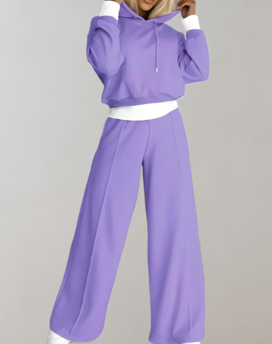 Athletic style women's tracksuit set featuring a long-sleeve hoodie and coordinating track pants.