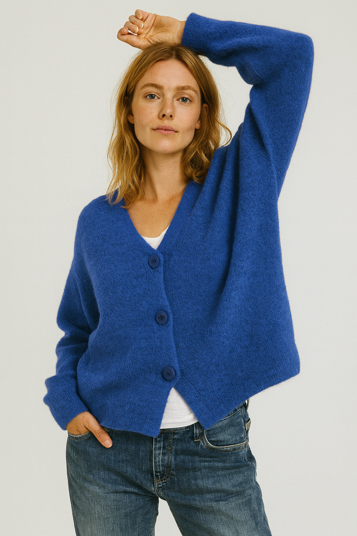 Soft, lightweight women's spring cardigan with functional buttons, ideal for versatile fashion.