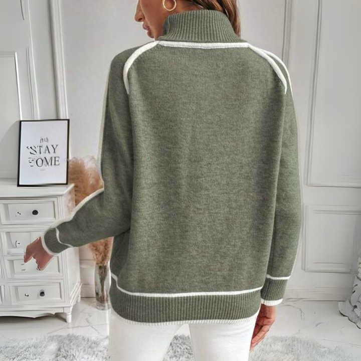 Model wearing a women's long-sleeve knit sweater in a relaxed fit, great for spring comfort