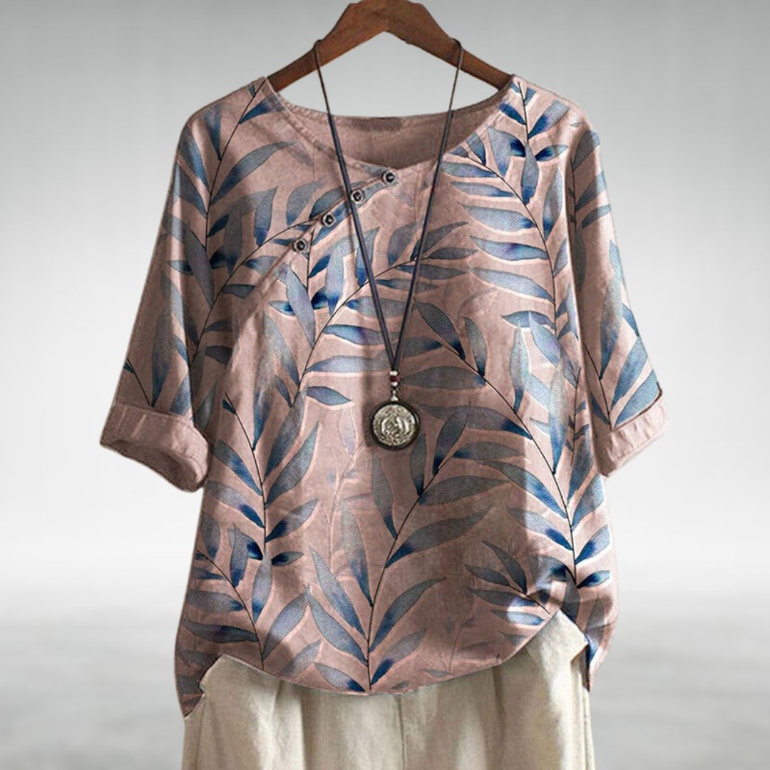 Lightweight women's casual blouse with vibrant leaf print, button-up front, and relaxed fit