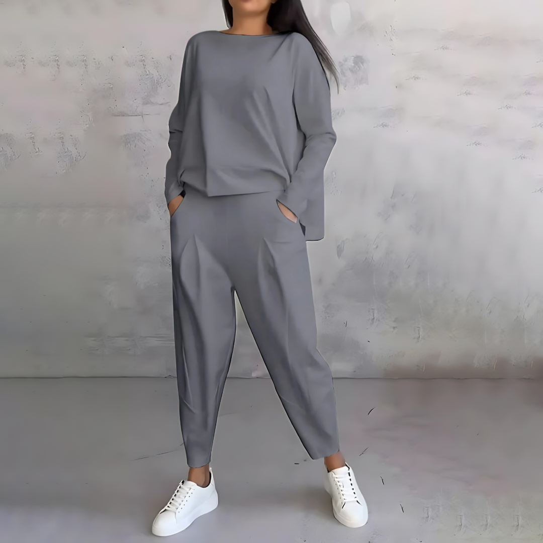 Elegant women's two-piece outfit: loose-fit top and tapered pants for a relaxed, stylish look.