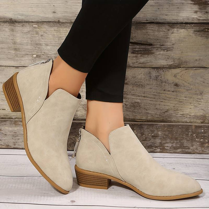 Comfortable women's ankle boots featuring a low heel and slip-on design for ultimate convenience.
