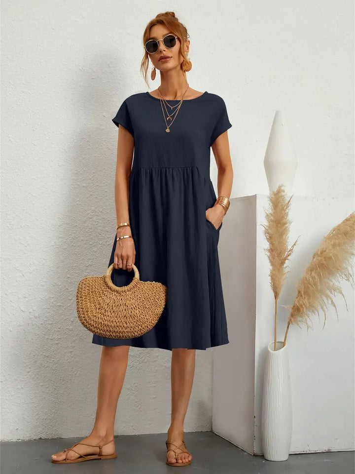 Versatile women's casual midi dress, easy-to-wear with pockets for comfortable spring and summer days.