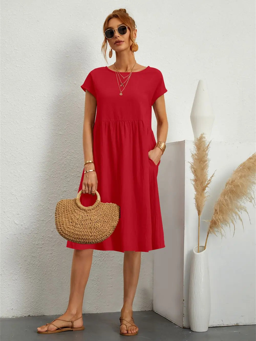 Comfortable women's loose fit midi dress with pockets, great for casual spring and summer activities.