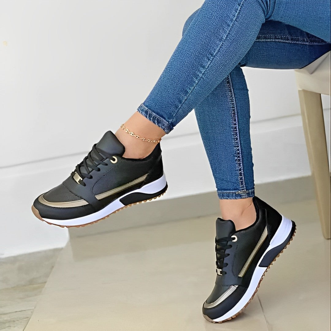 Close-up of a women's casual walking shoe, highlighting the non-slip tread and soft, flexible material