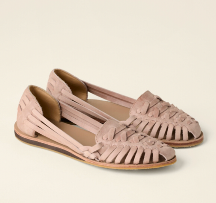 Close-up of women's open-toe comfort sandals featuring soft straps and a cushioned sole