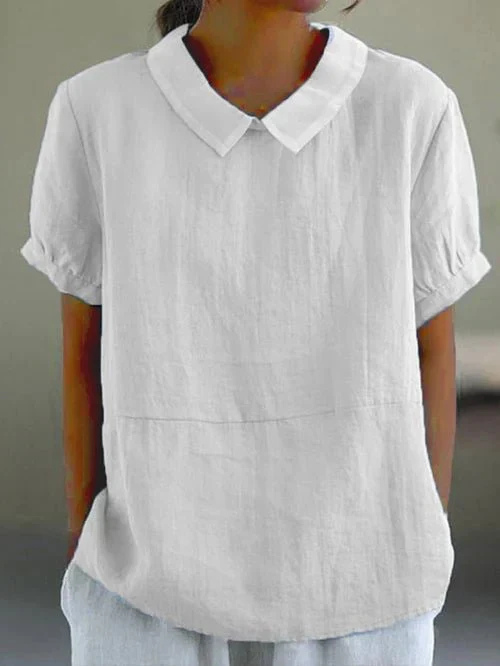 Chic women's Peter Pan collar short sleeve top, perfect for spring/summer fashion. Relaxed fit, feminine apparel.