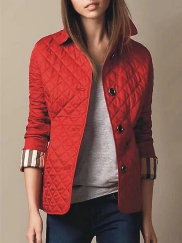 Fashionable women's quilted jacket, great for casual fall and winter style. Adorned with a turned-down collar.