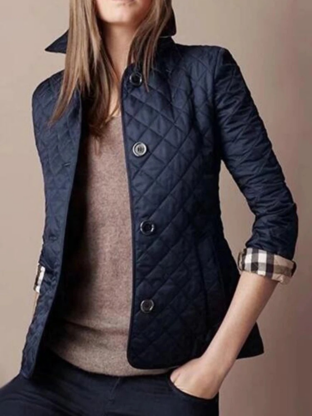 Textured quilted women's jacket with a classic turned-down collar, perfect for versatile fall & winter fashion.