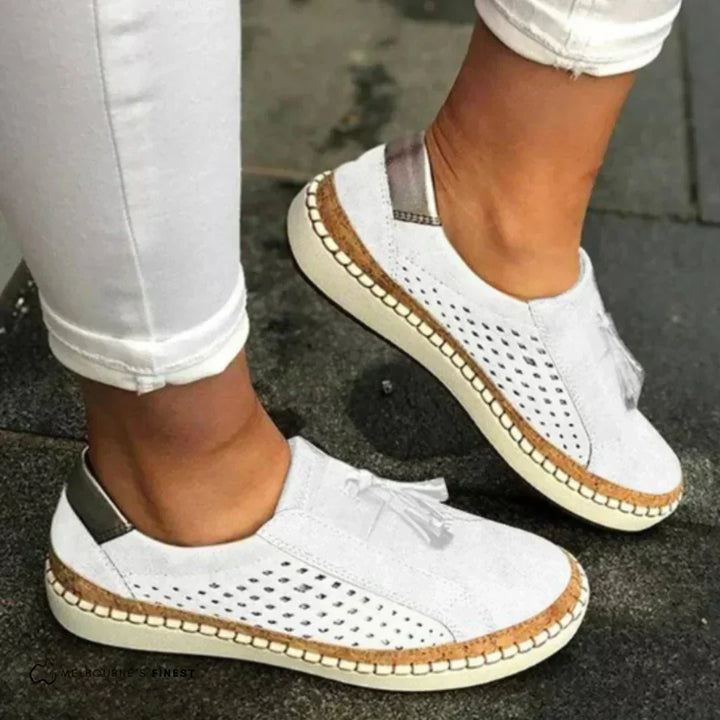 Close-up of a women's slip-on loafer showing the stitching details for casual footwear.