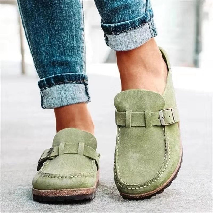 Fashionable women's flat loafers featuring a stylish buckle, ideal spring and summer footwear.