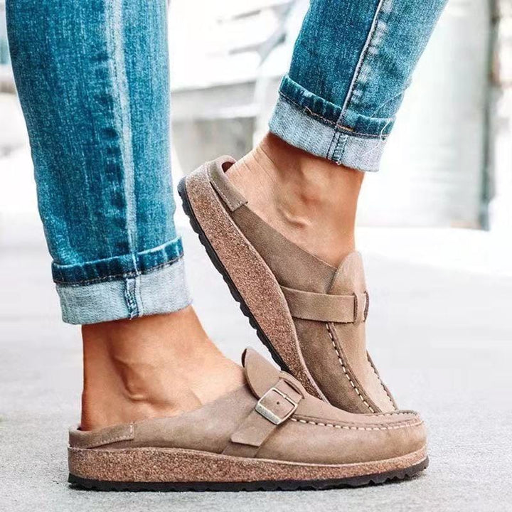 Stylish women's buckle slip-on loafers, offering fashionable and comfortable footwear for various outfits.