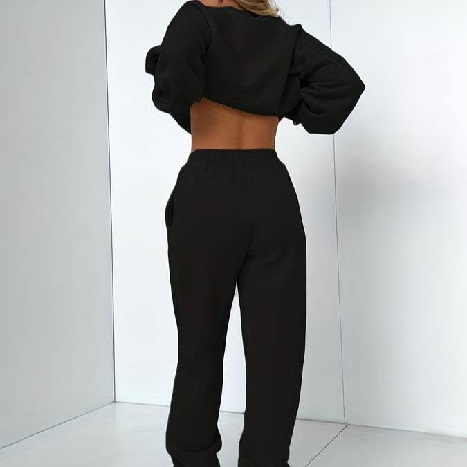 Stylish women's two-piece jogger set, including a long-sleeve sweatshirt and matching pants.