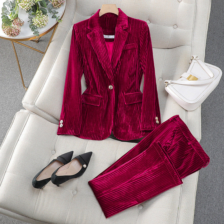 Women's casual tailored blazer and pant suit set in a neutral color, perfect for business casual.